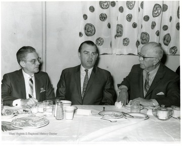 'Left to right:  Charles C. Wise Jr., Robert E. Maxwell, Dr. Thomas Harris.'