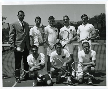 Group portrait of the 1965 West Virginia University Tennis Team. Members pictured included: Dave Rankins, Tom Hanna, Dick Garret, Eddie Ray, 'Mere' Moore, J. Fast, Captain, Donnie Abrahams. Absent: John Hefner, Manager. Taylor Publishing Company, Picture Number 2, Page 218, West Virginia University, Morgantown, West Virginia.'
