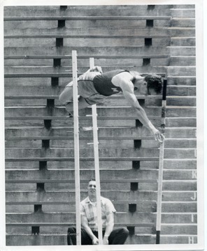 Ed Zuraw, a member of the West Virginia University Track Team competes in the pole vault.