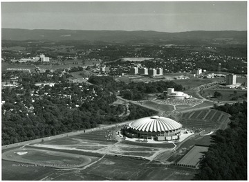 Aerial view of the W. V. U. Evansdale Campus showing the coliseum, engineering buildings, dorms, creative arts center and hospital.