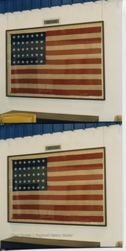 The 35 star flag hanging in the WV Collection represents the time period when West Virginia was the state most recently admitted into the Union in June 1863.