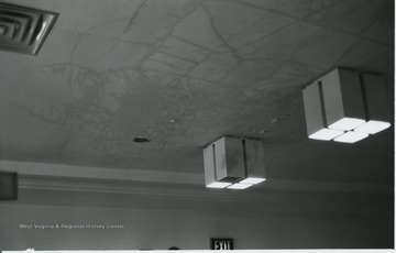View of lights and cracks in ceiling.