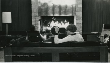 Relaxing in front of Mountainlair fireplace in Vandalia Lounge.