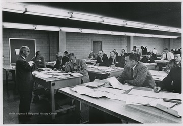 View of Harold Cather speaking during an exam for registration of engineers.