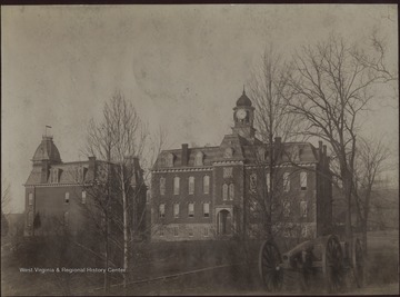 'Rear view of Martin Hall and side of Woodburn Hall before wings were added - taken between 1876 and 1899.'