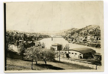 View of Basketball Hall, 'The Ark', West Virginia University, completed on November 4, 1916 and other downtown campus buildings and the Monongahela River in the background.  Steel bridge over the Monongahela river in the background.