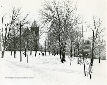 'View of the library (now Stewart Hall), and the President's Home (Now Purinton House), taken during the winter of 1911-1912.'