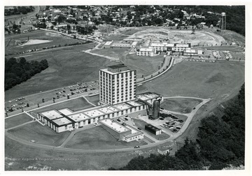 'Towers Dormitory and Forestry Building under construction, Agricultural Sciences Building, Engineering Building, and Agricultural Engineering Building.' 