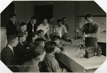 Instructor performing an experiment.