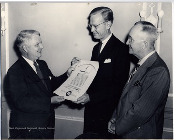 'Reese D. James Chairman Committee on Awards) as he presented to Joseph W. LaBine, editor Publishers' Auxiliary, a Citation to that periodical which was awarded at the Hotel Continental, Chicago, June 29, 1947, by the American Society of Journalism School Administrators. P. I. Reed, president, looks on.'