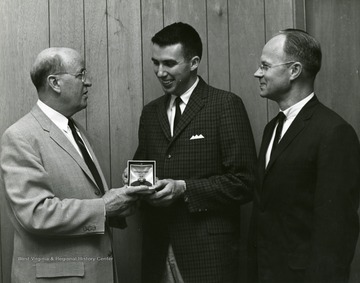 Left to right, Dean C. M. Frasure, Arts and Sciences; H. D. Price; Dr. G. L. Humphrey, Professor and Associate Chairman, Chemistry. 