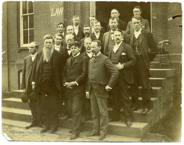'Second Row, from right, front row: Robert Armstrong (English Department), Second from right, third row: Thomas E. Hodges (President of WVU), Second from left, back row: William Willey.'