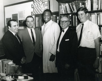 Left to right, Robert E. Lanham, Assistant Professor; Joe Clark Theiss, Teaching Assistant; Unknown; Dr. Royal C. Gilkey, Professor; John Barnes, Graduate Assistant.