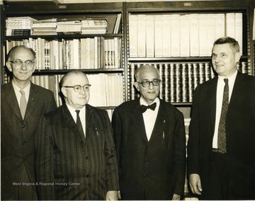 Left to Right, Armand Singer, French; Warren F. Manning, French; Unknown; Robert Stilwell, Head of Department of Foreign Languages, Spanish, German.