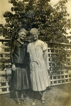 Susan M. Moore (dark dress), Grace Martin Snee (light dress).