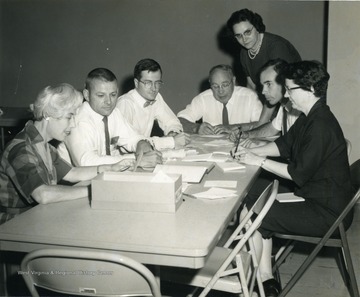 Left to right, Babette Graf, Unknown, Tony Winston, Dr. Vehse, Helen Pavlech, Unknown, Ellen L. Sumner.