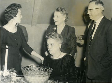 Mrs. James Henning (standing), Miss. Ruth Noer (seated), unknown, Dr. J.P. Brawner, Head of English Department.