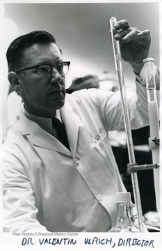 Dr. Valentin Ulrich working with scientific instruments.