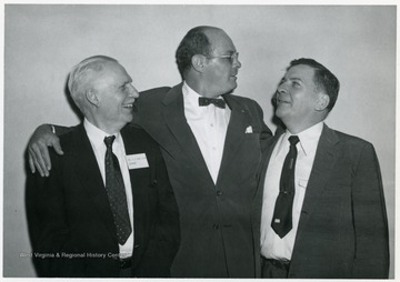 Dean Van Liere standing on the left beside two unidentified men, at the Fraternity Convention in Miami.