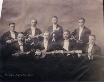 WVU Mandolin and Guitar Club members, mostly unidentified.  Identified members include:  Earle Miller (front row, third from the left), Fred B. Deem (back row, far left), and Ed McWhorter (front row, far left).