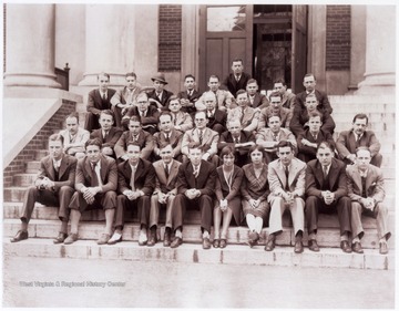 This class photograph was taken on the steps outside Colson Hall. None of the subjects are identified.