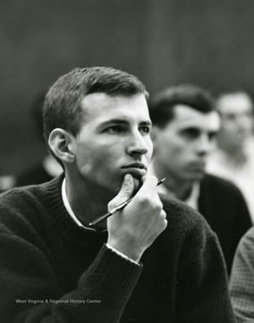 Unidentified male student focused on a class lecture at WVU.