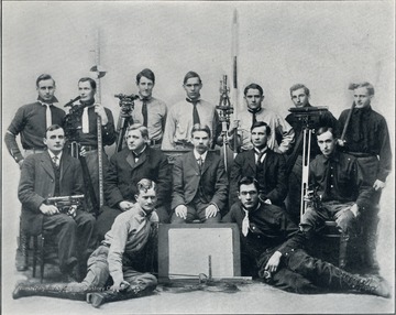 Senior Civil Engineers, posing for a group photograph with engineering equipment.