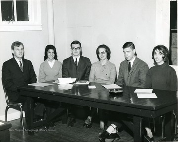 Members of the 1965 Student Court seated around a table.