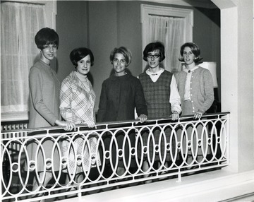 Associated Women Students Officers of WVU pose on the second floor of Elizabeth Moore Hall: from left to right Terri Hertznell, Unknown, Unknown, Becky Clise and Carolyn McCue.