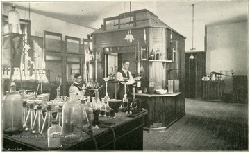 Two researchers work in the chemical lab of the Agricultural Experiment Station.