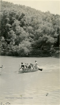 Cadets in a canoe on a river.