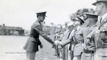 Cadet shaking hands with officials.