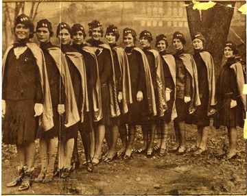 'These pretty co-eds are sponsors of the military unit of West Virginia University. Left to Right: Mary Jo Matthews, Dorothy Williams, Dorothy Dering, Dorothy Brand, Mary Goodwin, Thelmas Brand, Mary Dilworth, Martha Bromberg, Barbara Dowd, Dorothy Manassee, Helen Deffinbaugh, and Kathryn Preston.' 
