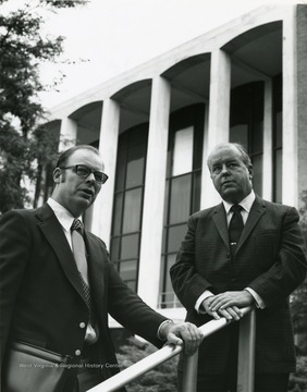 President Harlow with a man at a top of steps located between Mountainlair and Stewart Hall. 