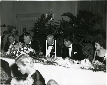 President and Mrs. Elvis J. Stahr are seated on the far right.