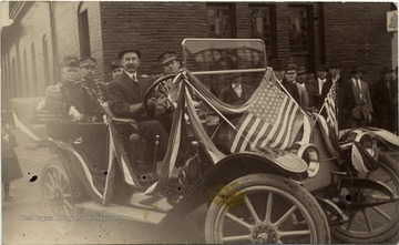 G. C. Baker, Otto Sigwart, Gen. Elliot, National Guard, Russell Huston, and Major Butts in a car for the Inauguration of West Virginia University President Thomas Edward Hodges.
