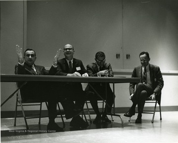'Professor of physics-at-large and legendary 'Father of the H-Bomb' Edward Teller (left) is shown speaking at a panel discussion of the Science-Writing Symposium, Oct. 6, 1967.  Also shown are panelists Harvey Rexroad, WVU prof. of physics (second from left), and George Diab, vice-president of WTRF-TV in Wheeling (second from right) and moderator John Troan, editor of the Pittsburgh Press (right).