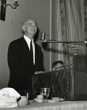 'Two-time winner of the Nobel Peace Prize, Linus Pauling, is shown speaking at the Oct. 6, 1967 Science-Writing symposium.  Vincent Traynelis, WVU prof. and chairman of chemistry and moderator of the session, is shown at the right.'