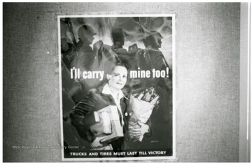 Exhibit in second floor gallery of Mountainlair. Poster says, 'I'll carry mine too!  Trucks and tires must last till victory.'