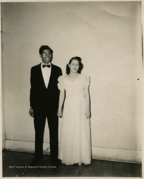 Male and female students in formal clothing.