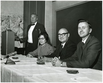 'T. H. Hunter, Chancellor for Medical Affairs at the University of Virginia (left), is shown with the three WVU professors who served as panelists to react to his address: Lila Abrahamson, Prof. of Biology (second from left); J.C. Eaves, Prof. and Chairman of Mathematics (second from right); and Vincent Traynelis, Prof. and Chairman of Chemistry (right).  Nov. 28, 1967 seminar on the Future of Undergraduate Education at WVU.'