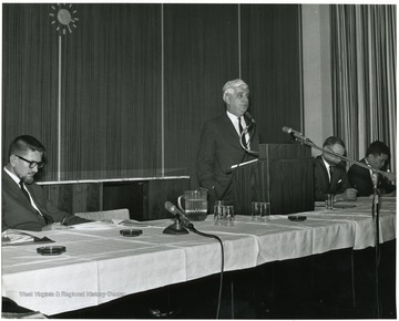 'Dr. W. Gordon Whaley, University of Texas Graduate School is shown speaking at the Dec. 6, 1967 seminar on the Future of Graduate Education at WVU.  Panelists are: Hugh Lindsay, Prof. of Physiology (left): Homer Patrick, Prof. and Chairman of Agricultural Biochemistry (second from right); and Chin-Yung Wen, Prof. of Chemical Engineering (right).'
