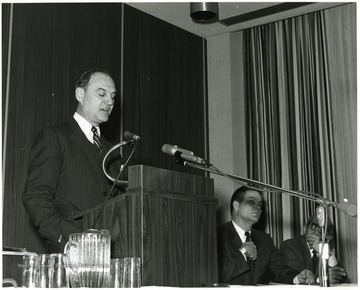 'Dr. Everett Walters, Vice-President for Academic Affairs at Boston University (left), is shown speaking at the Dec. 6, 1967 seminar on the Future of Graduate Education at WVU.  Two WVU professors who served as panelists are shown:  Paul Selby, dean of the College of Law (center), and Leo Fishman, Professor of Economics and Finance (right).'