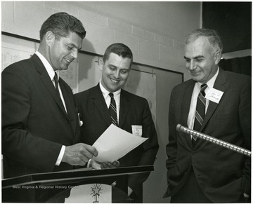 'State Commissioner of Commerce Angus Peyton (left) and WVU professors Roy Bahl (center) and John D. Photiadis (right).' This event was a part of WVU's Centennial Celebrations.