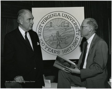 'Dr. William C. Steere, director of New York's Botanical Garden, and speaker at the May 11, 1967 Author's Banquet, chats with Dr. Earl Core, one of WVU's honored authors.'