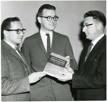 Robert F. Munn receives a book titled 'Great Jewish Personalities.'