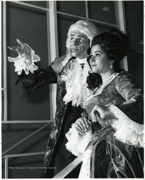 A scene from 'School for Scandal': left Bod Merriam as 'Lord Peter Teazle'; right Evy Andrews as 'Lady Teazle'.