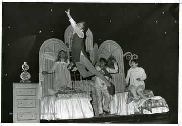 A scene from WVU drama production 'Peter Pan' shows him flying in a children's bedroom.