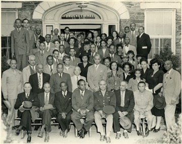The only identified member is Richard McKinney seated, fourth from left in front row.