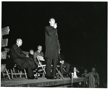 Julius Singleton (4th from left) speaks, on the stage with him (from left to right) Dave Jacobs; Tommy Miller; President Miller and Singleton.